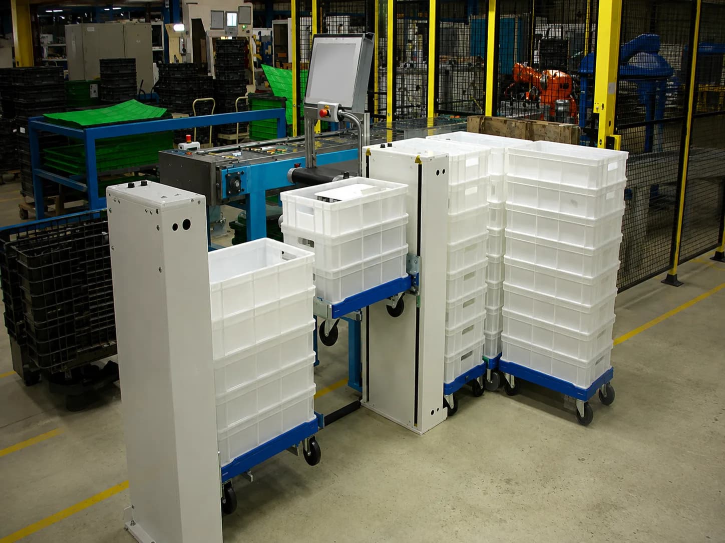 Multiple vertical lift units supporting tote-box handling within an automated production area